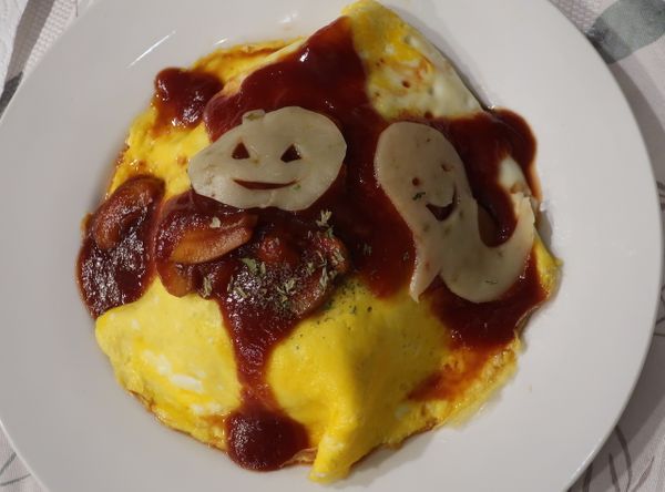 Omurice with demi glace sauce and Halloween character cheese （Halloween omelet insides with fried rice, ハロウィン風デミグラスオムライス ）